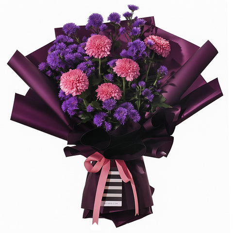A striking bouquet featuring full pink chrysanthemums and delicate purple asters. It is elegantly wrapped in deep purple paper with a modern black and white striped accent at the base. The arrangement is tied with a pink ribbon bow, creating a full, rounded shape. This sophisticated bouquet is perfect for birthdays, anniversaries, or as a thoughtful thank-you gesture.