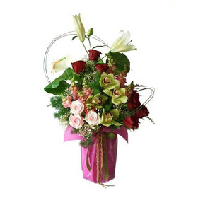Arrangement Of White Lilies Red Roses Pink Roses Cymbidium And Fillers in Vase